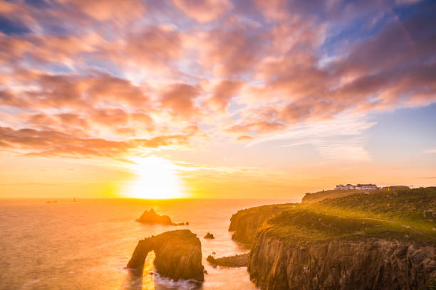 istock Dramatic sky at sunset with Enys Dodnan and the Armed Knight rock formations at Lands End 1197883970