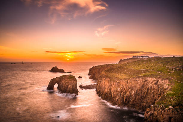 istock Dramatic sky at sunset with Enys Dodnan and the Armed Knight rock formations at Lands End 1197884522