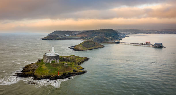 Mumbles Head in Swansea Bay Aerial view of a Offshore island with lighthouse on Mumbles Head in Swansea Bay gower peninsular stock pictures, royalty-free photos & images