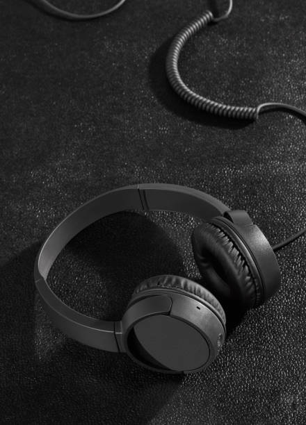 istock Black headphones on desk 1197887040