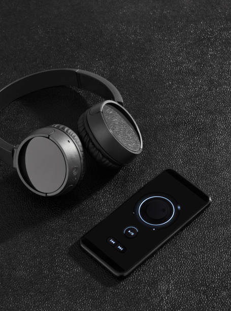 istock Black wireless headphones and mobile phone 1197887052