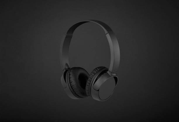 istock Black headphones on black background 1197887071