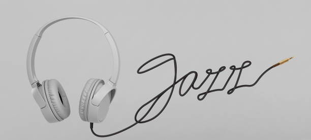 istock Headphones with jazz cable on gray background 1197887115