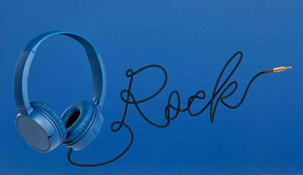 istock Headphones with rock cable on blue background 1197887126