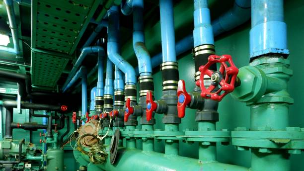 istock red gate valve on foreground with pipelines of main water pressure control in engine room area of fishing vessel 1197887192