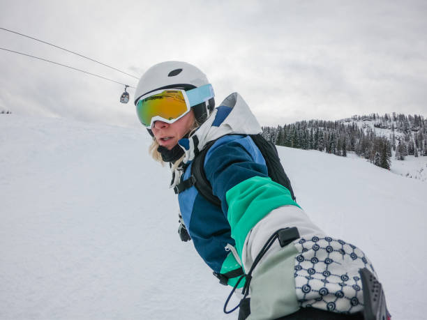 istock Woman Snowboarding Portrait 1197889608