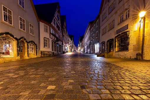 Old traditional medieval street in night illumination. Rothenburg ob der Tauber. Bavaria Germany.