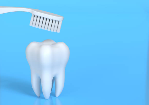 istock Toothbrush and white tooth on a blue background 1197890876