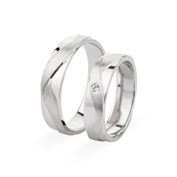 istock Pair of silver wedding rings isolated on white background 1197891063