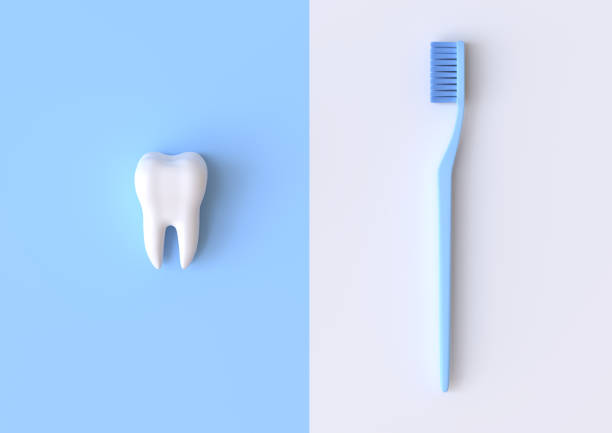istock Toothbrush and white tooth on a blue background 1197891578