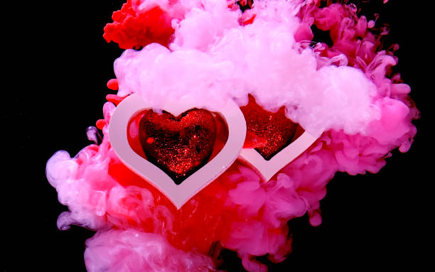 istock Two white hearts with red hearts inside on a beautiful pink background. Concept for Valentine's Day February 14th. 1197893924