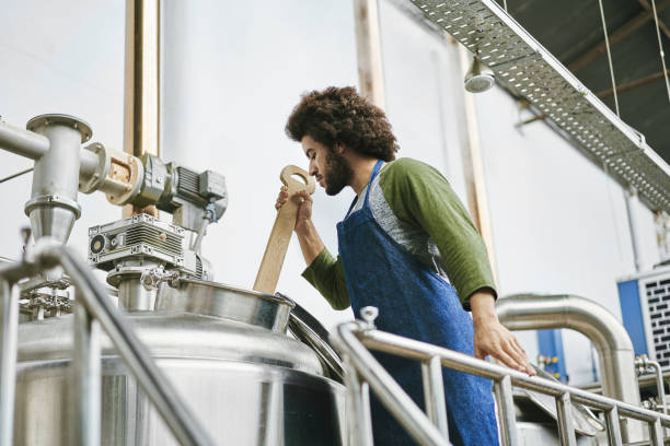 istock Native American Male Brewery Worker Checking Beer Batch 1197894082