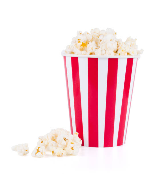 istock Popcorn in red and white cardboard box for cinema isolated on white background 1197894708