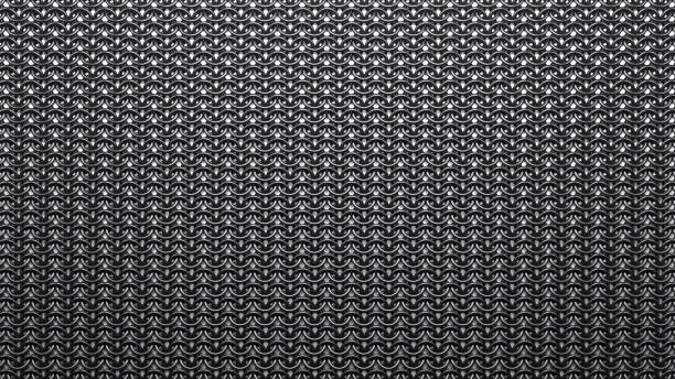 Part of a metal chain mail. Texture of chain mail from metal rings close-up. chain mail stock pictures, royalty-free photos & images