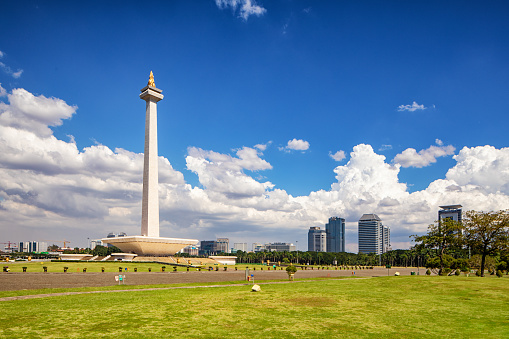Wide angle view of national monument in Jakarta Indonesia on sunny Springtime day.