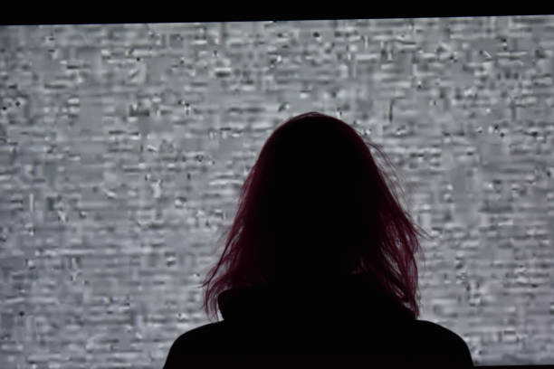 istock Girl with long hair staring at static 1197902581