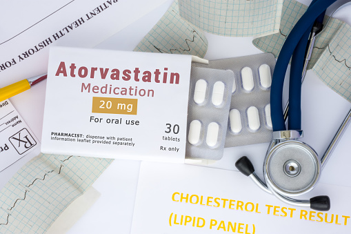 Atorvastatin active ingredient in drug as international nonproprietary name of active pharmaceutical substance concept photo. Packaging with label 