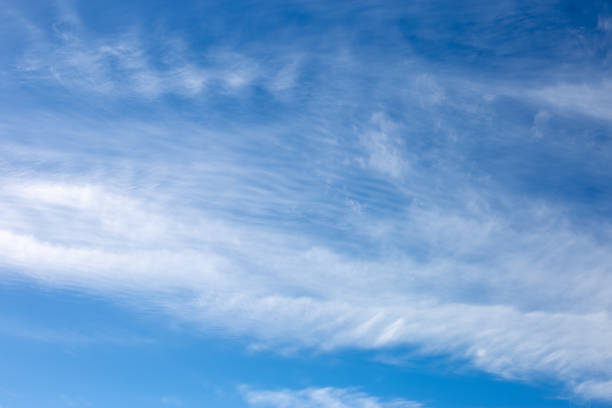 istock Background of blue sky with white moving clouds 1197906787