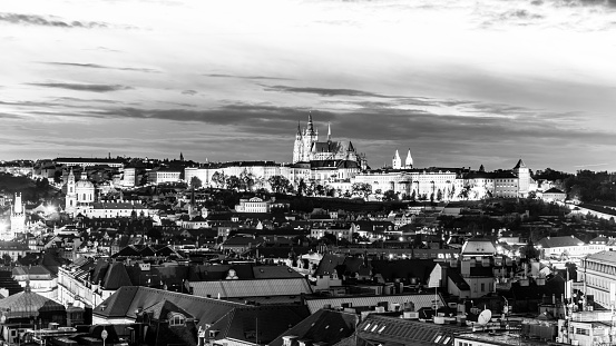 Prague Castle evening scenery. Hradcany with St Vitus Cathedral after sunset. Prague, Czech Republic. Black and white image.