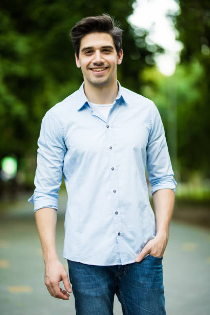 istock Thoughtful casual young man outdoors looking up and smiling 1197913226