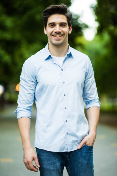 istock Thoughtful casual young man outdoors looking up and smiling 1197913242