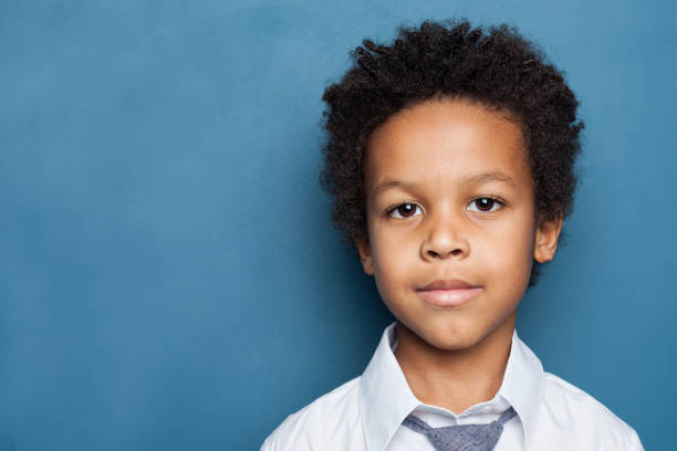 istock Child boy face on blue background 1197913290