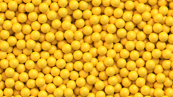 Yellow balls background. Pile of yellow toy balls, sugar coated candy, pills or vitamins. Realistic vector background
