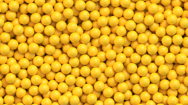 Yellow balls vector background Yellow balls background. Pile of yellow toy balls, sugar coated candy, pills or vitamins. Realistic vector background balloon designs stock illustrations