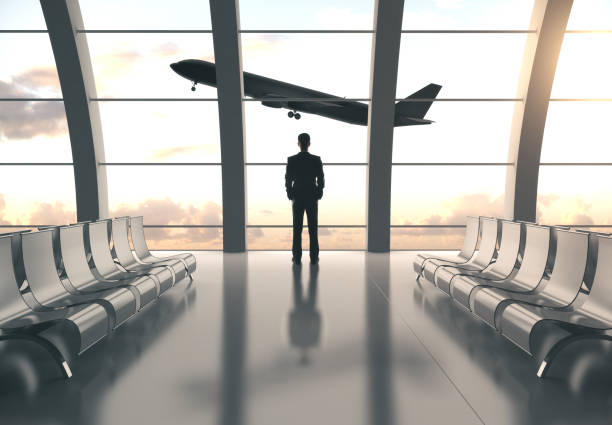 istock Businessman standing in airport 1197918262