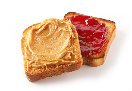 toasted bread with peanut butter and jam isolated on white background
