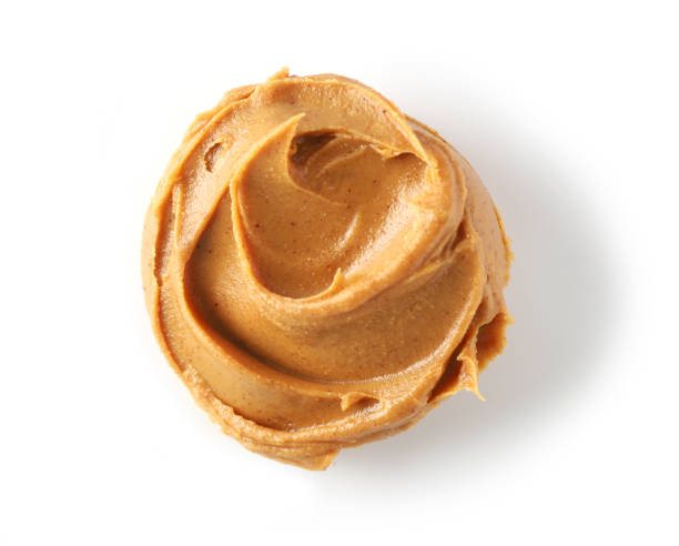 istock peanut butter isolated on white background, top view 1197919657