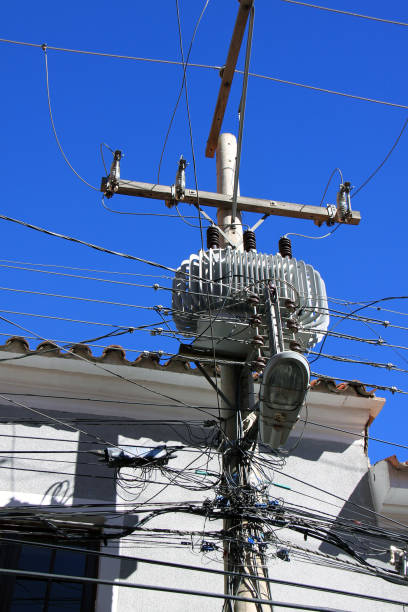 istock Messy electrical cables and tangled wires on electric pole in Bolivia. 1197919721