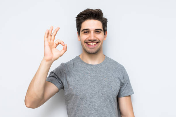 istock Happy man giving okay sign t on white background 1197920431