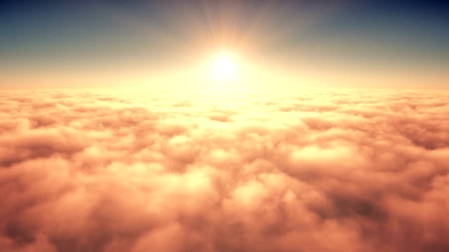 Flight Above The Clouds In The Rays Of Rising Sun. 4K.