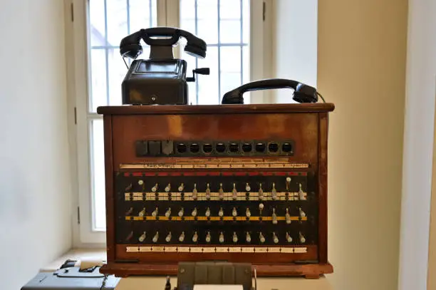 An antique telephone switchboard of the kind used in hotels and companies in the mid-20th century.