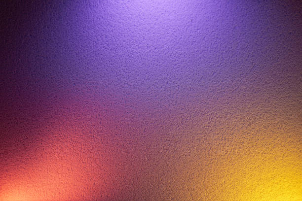 istock Yellow and pink glow on purple background 1197926922