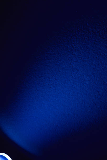 istock Light blue ray of light on a dark blue background 1197927287
