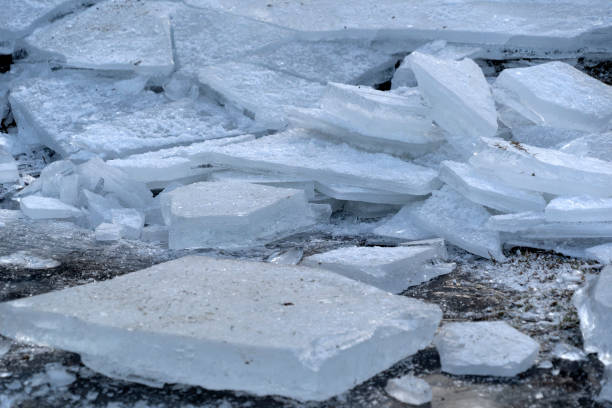 istock icicles frozen ice on grass lake 1197928457