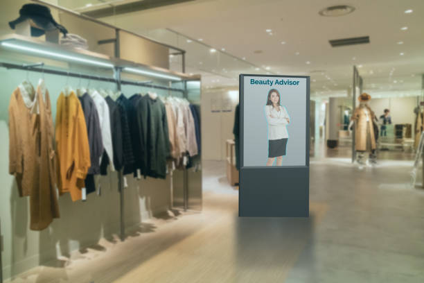 istock iot smart retail futuristic technology concept, smart Digital Signage display with virtual or augmented reality in the shop or retail advice to choose select ,buy cloths and give a rating of products 1197931278