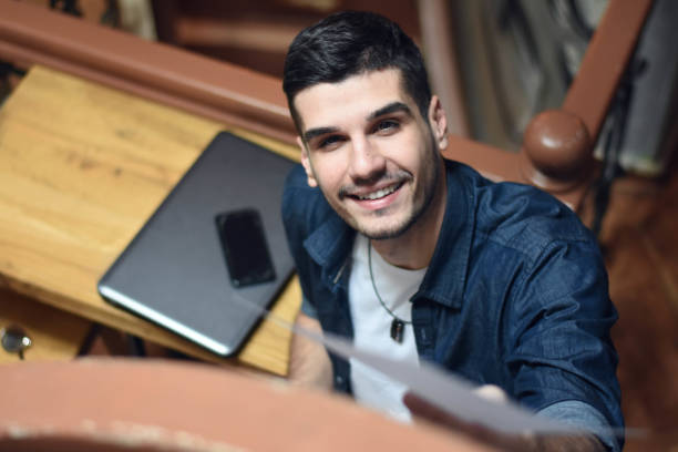 istock Young handsome businessman in coffee shop 1197932486