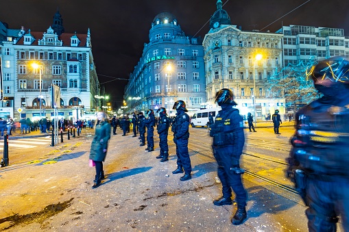Prague, Czech Republic - January 1, 2020: the police pays attention for not entering the streetcar rails due of drunken people at the silvester party in Prague.