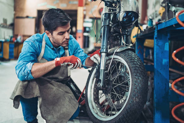 istock Biker repairing his motorcycle 1197932659