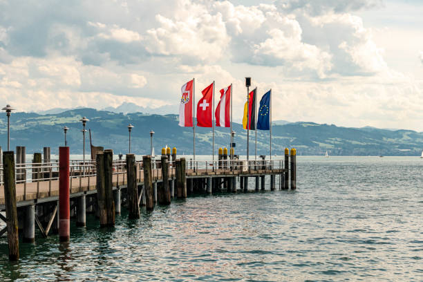 Lake Constance or Bodensee with flag and pier, Germany