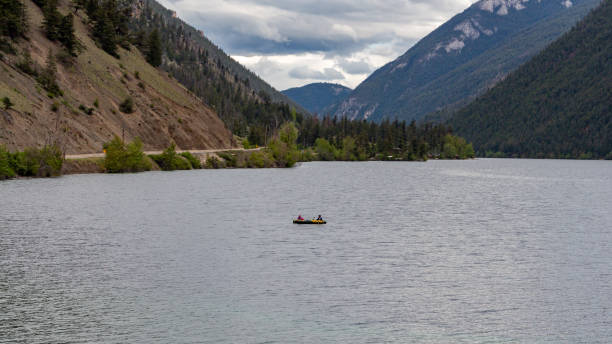 istock Sole kayaker on a wide lake surface 1197933594