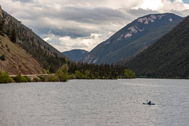 istock Sole kayaker on a wide lake surface 1197933612
