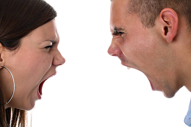 istock Young couple yelling at each other isolated on white 119793454