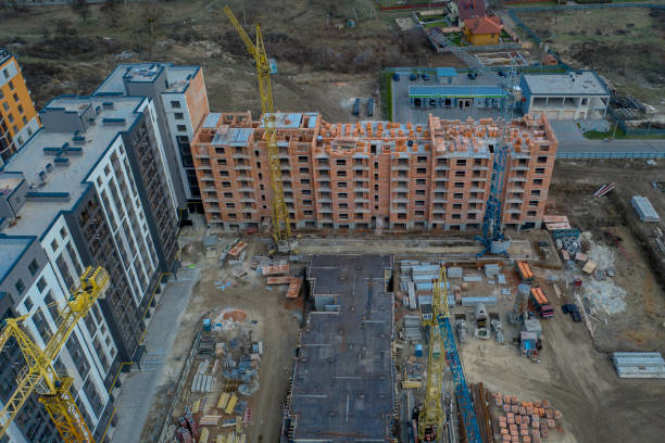 istock Construction and construction of high-rise buildings, the construction industry with working equipment and workers. View from above, from above. Background and texture 1197938277