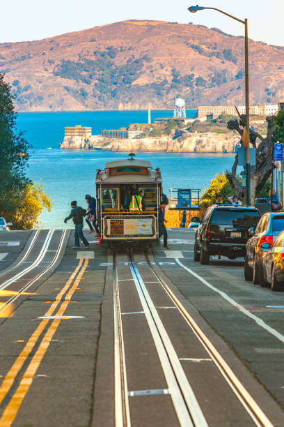 San Francisco, United states of america - december 16: Passengers enjoy a ride in a cable car on Dec 16, 2013 in San Francisco. It is the oldest mechanical public transport in San Francisco which is in service since 1873.