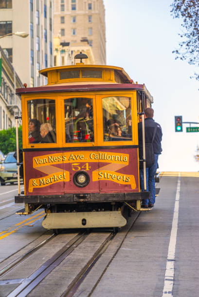 San Francisco, United states of america - december 13, 2013: Passengers enjoy a ride in a cable car in San Francisco. It is the oldest mechanical public transport in San Francisco which is in service since 1873.