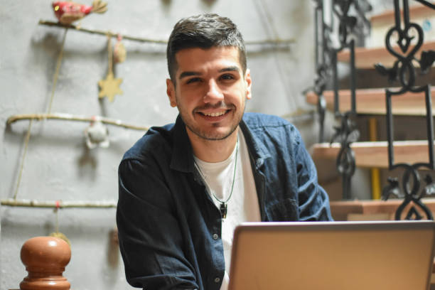 istock Young handsome businessman in coffee shop 1197939354